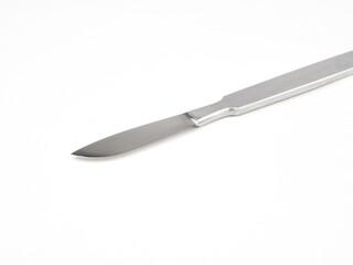 the steel medical scalpel on a white background