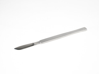 the steel medical scalpel on a white background