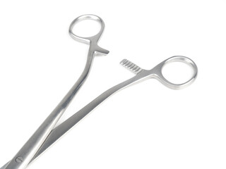 steel surgical clamp on white background