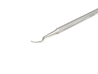 steel surgical curettages on a white background