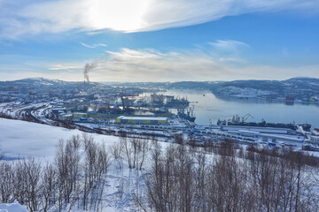 top view of the docks and the unfrozen sea against the backdrop of mountains