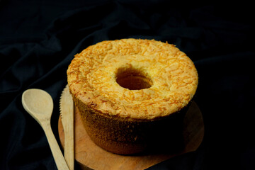 cheese chiffon cake on black background