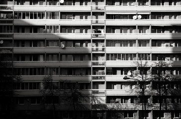 Block of flats, black and white photography, urban building, real estate concept.  Council tower block. Expensive prices for flats and apartments in the city.