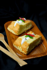 cheese chiffon cake on black background