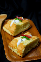 cheese chiffon cake on black background