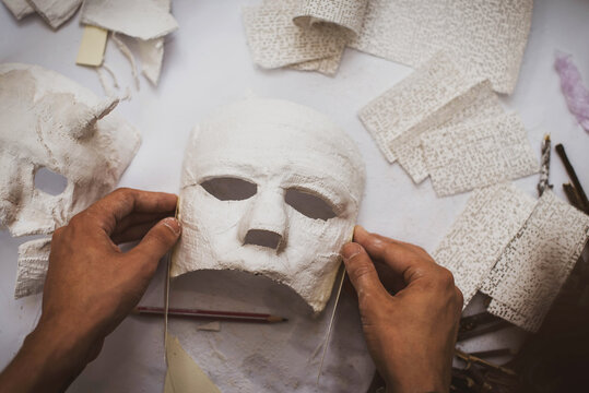 creating masks based on a plaster cast. Gypsum mold. Cast of the face. Sculpting. The workflow of the artist.