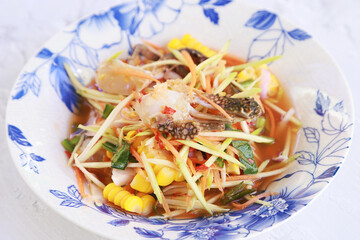 Close up blue crab spicy salad Thai style, Favorite healthy food for diet in Thailand, Food tradition asian vegetable