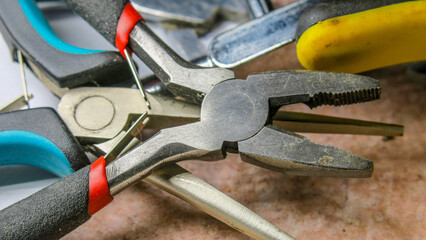 Metal pliers on the side in the workshop
