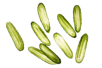 Cucumber green slices pattern isolated on white background. Creative cucumbers wallpaper, food backdrop design