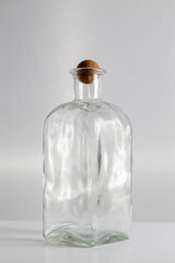 clear glass bottle, with round cap