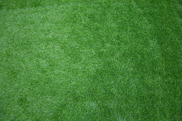 Fototapeta premium Top view of the artificial turf flooring used for the flooring of football matches and other indoor activities.