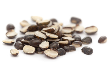 Micro close-up and details of Organic Indian splitted black urad dal (Vigna mungo) isolated over white background.