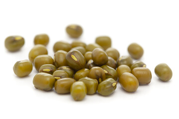 Micro close-up and details of Organic Indian green Gram (Vigna radiata) or whole green moong dal  isolated over white background.