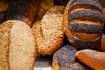 Various bread on shelf and in basket, Homemade bread. Fresh baked bread in baker shop.