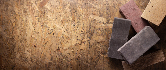 Construction brick on wooden background. Brick and osb texture floor