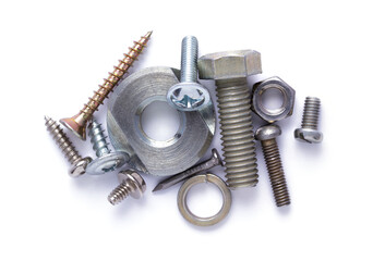 Set of old metal screw, bolt head, nut, washer and spring washer tool isolated at white background