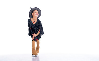 Little young skater posing in witch costume for halloween on ice on white background