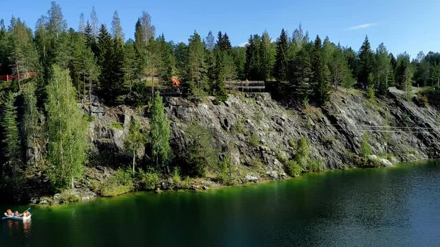 Marble quarry with the lake in Ruskeala park on a sunny day. Panoramic view