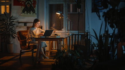 Young Successful Female Works on a Laptop Computer in Creative Agency in Loft Office in the...