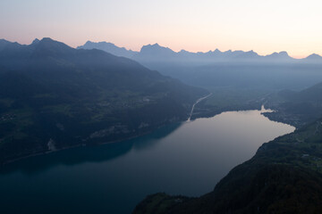 Amazing view over Lake Walen in the Canton Glarus, Switzerland. Wonderful sunset and sunrise in the swiss alps. This is a great place to hike and enjoy the beautiful nature in Switzerland.