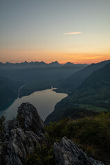 Obraz premium Amazing view over Lake Walen in the Canton Glarus, Switzerland. Wonderful sunset and sunrise in the swiss alps. This is a great place to hike and enjoy the beautiful nature in Switzerland.