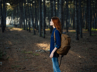 pretty red-haired woman forest nature adventure