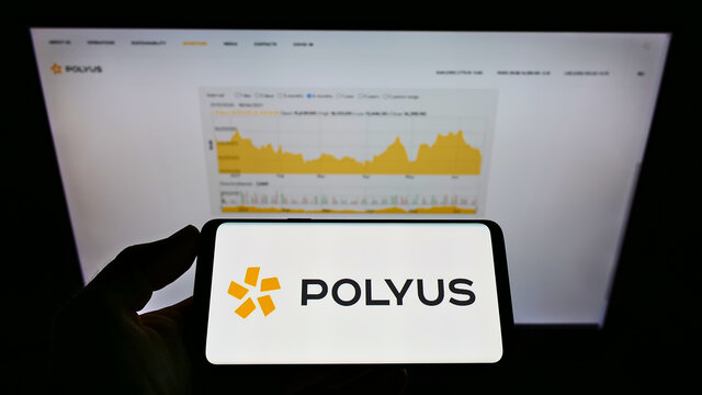 STUTTGART, GERMANY - Jun 20, 2021: Person Holding Smartphone With Logo Of Gold Mining Company PJSC Polyus On Screen In Front Of Website