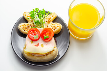 Reindeer shaped crumpets served with ham, tomato, cucumber, and watercress