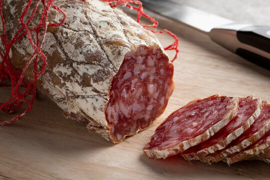 Fresh sliced Rosette de Lyon, a French pork saucisson close up 