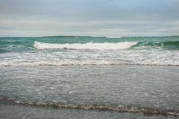 Beautiful dramatic sea waves and gloomy sky