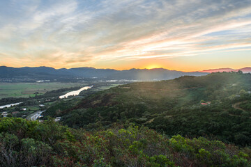 landscape of mountains, sunset and clouds with a beautiful sky, the nature of Algeria in North Africa, Maghreb, plains and grass in the mountain, Mediterranean climate, Forest and green trees. sunrise