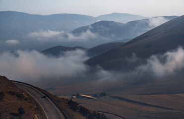 Beautiful mountains landscape, huge fluffy clouds descended to the mountain tops. Nature mountain...