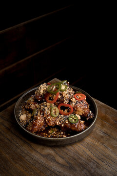 Chicken wings decorated with peppers