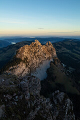 Amazing view to the Lake Lucerne at an epic sunrise in the morning of a beautiful day. Drink a beer at the restaurant at the peak of this mountain called Mythen and watch the birds fly.