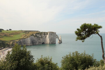 the hollow needle rock at the white limestone cliff coast in etretat in normandy 