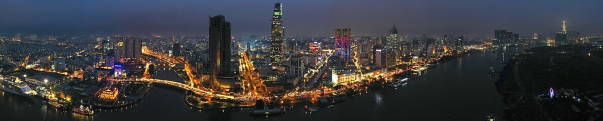 Aerial panoramic view of downtown Saigon (Ho Chi Minh) city skyline at night