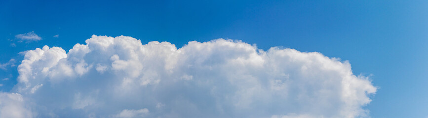 Naklejka na ściany i meble Big long white clouds in the blue sky