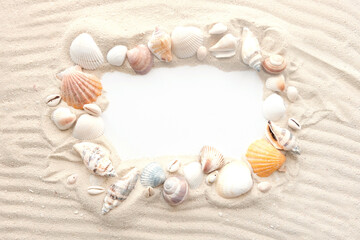 Blank white sheet of paper on white sand with seashells and stones. Message by the sea, romance, saint valenin's day, mother's, father's day. Copy space.