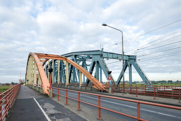 Fototapeta na wymiar Combined bicycle, pedestrian, car and rail bridge in Zutphen, Gelderland Province, The Netherlands