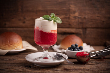 A delicious breakfast with strawberry granita and brioches, sicily.