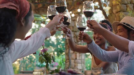 friends making toast celebrating dinner party drinking wine eating mediterranean food sitting at table enjoying beautiful summer day outdoors 4k footage 