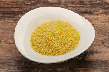 Raw cous cous heap in the bowl