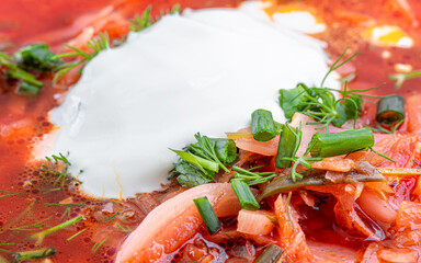 Russian borscht dressed with sour cream