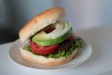 Burger with Onion Tomato Lettuce and Avocado