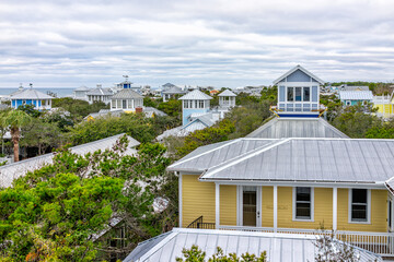 High angle aerial view on Gulf of Mexico sea ocean water in Seaside, Florida and cityscape of...