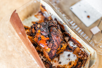 Half eaten loaf of golden baked good babka famous Jewish pastry made with chocolate and challah bread dough storebought with plastic package