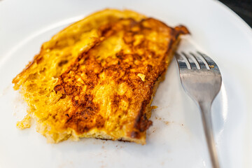 Closeup of homemade cooked challah brioche bread french toast fried serving savory eggy style on...