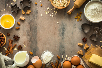 Ingredients for cooking baking. Food frame. Flour, sugar, butter, egg, milk and spices. Top view with copy space.