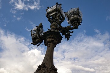 Fototapeta na wymiar Lamp post on the bridge of Alexandre III in Paris, France