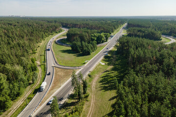 Transport junction road with vehicle car and truck movement logistic business concept. Aerial view